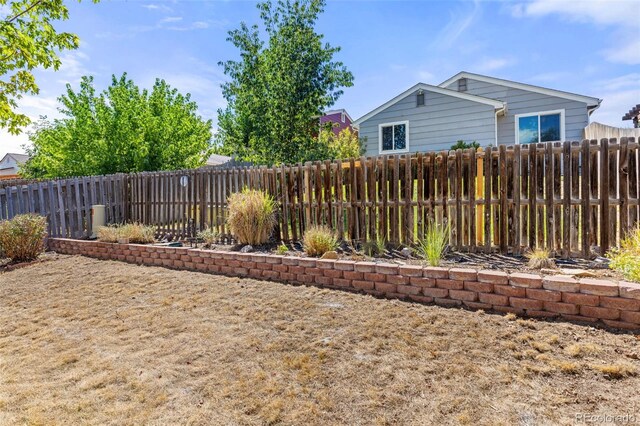 view of yard with a fenced backyard