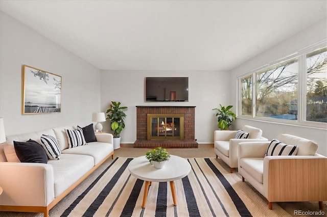 living room featuring a fireplace and light carpet