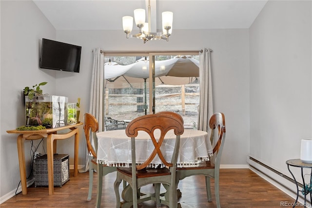 dining space featuring a notable chandelier, wood finished floors, baseboards, and a baseboard radiator