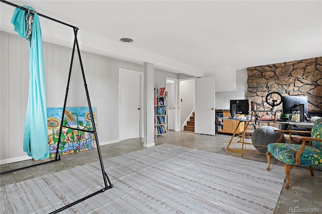 office area with visible vents and stone finish floor