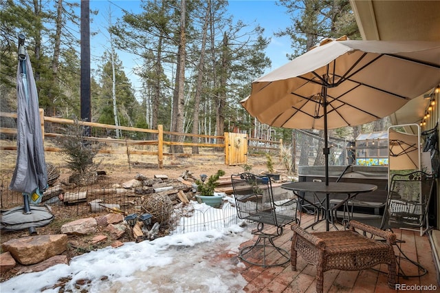 view of patio / terrace featuring outdoor dining area and fence