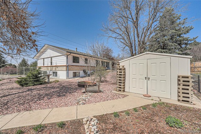 4090 S Tamarac Dr, Denver, CO 80237 - rear view of property featuring board and batten siding