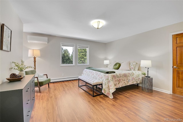 27100 Molly Dr, Conifer, CO 80433 - bedroom with a baseboard heating unit, an AC wall unit, light wood-style flooring, and baseboards