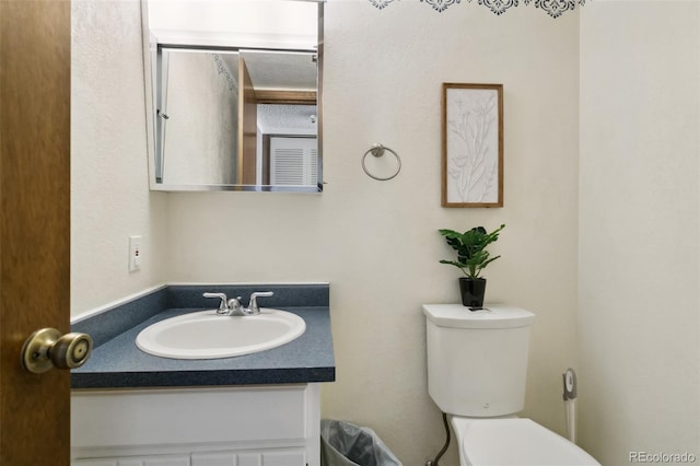6750 Lange, Colorado Springs, CO 80918 - bathroom with vanity and toilet