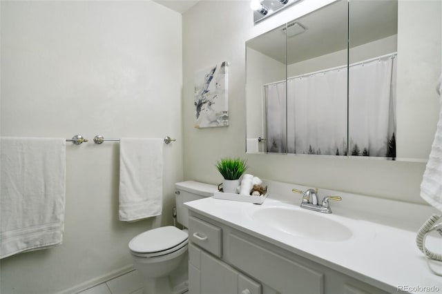 6750 Lange, Colorado Springs, CO 80918 - bathroom featuring vanity, toilet, and tile patterned flooring