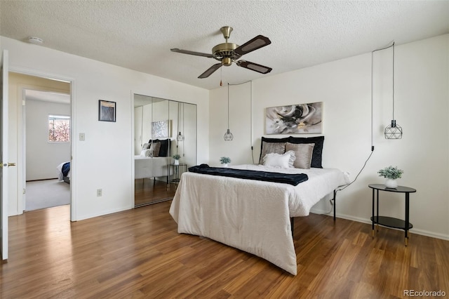 6750 Lange, Colorado Springs, CO 80918 - bedroom featuring wood-type flooring, ceiling fan, a textured ceiling, and a closet