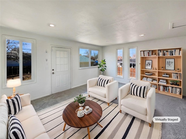 living room featuring recessed lighting, carpet flooring, and baseboards