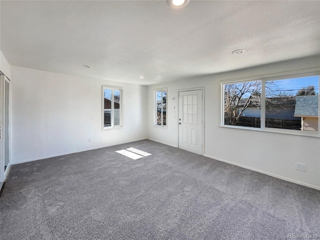 interior space with baseboards and recessed lighting