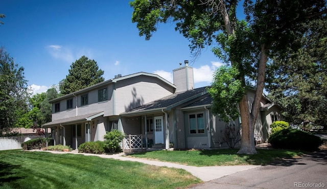 front facade with a front yard and a porch