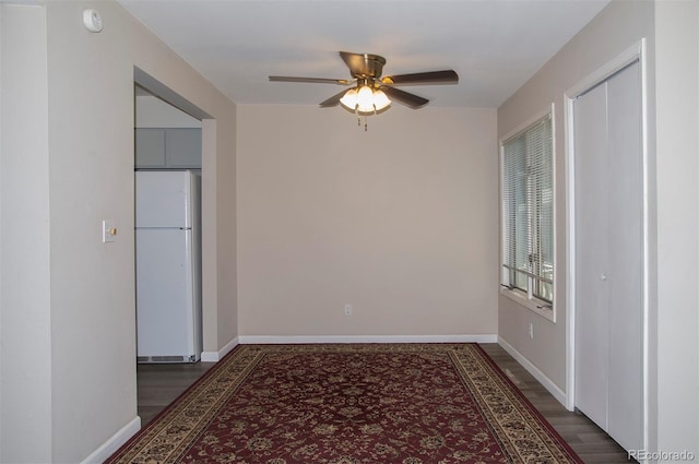 unfurnished room featuring ceiling fan and hardwood / wood-style flooring