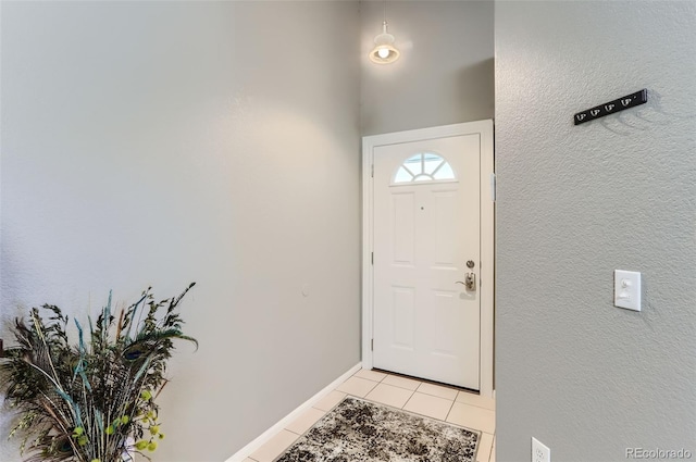 entryway with light tile patterned floors