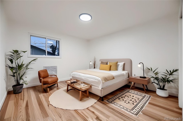 bedroom featuring hardwood / wood-style flooring