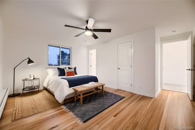 bedroom with ceiling fan and hardwood / wood-style flooring