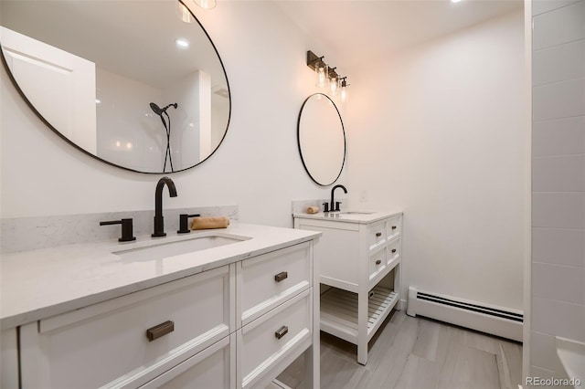 bathroom featuring vanity and a baseboard heating unit