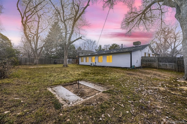 view of yard at dusk