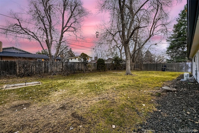 view of yard at dusk