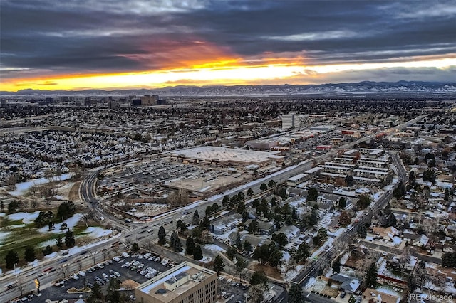 aerial view at dusk featuring a mountain view