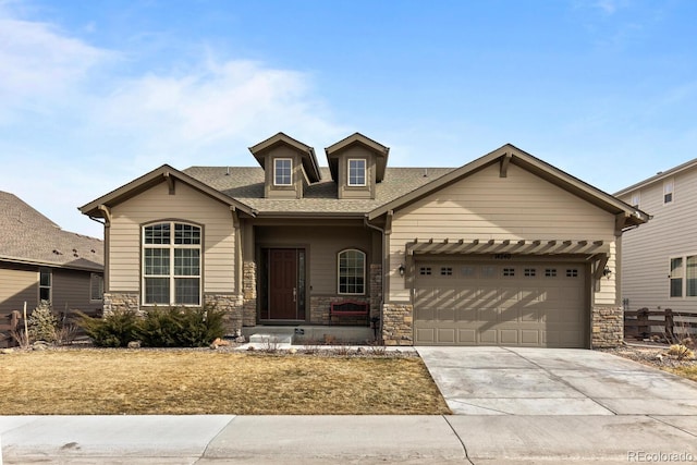 view of front of property featuring a garage and covered porch