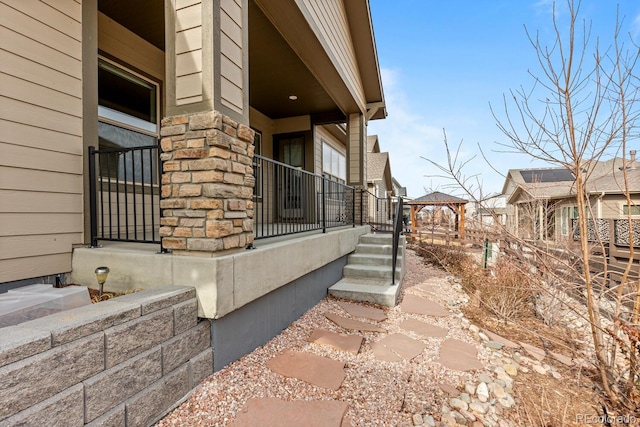 view of property exterior featuring a gazebo