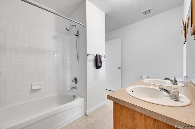 2791 Quarterland St, Strasburg, CO 80136 - bathroom featuring shower / bath combination, double vanity, and baseboards