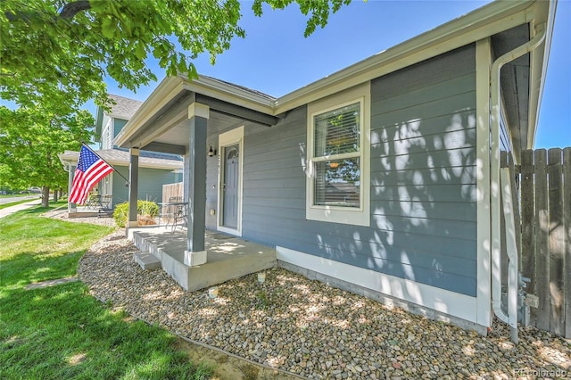 2791 Quarterland St, Strasburg, CO 80136 - view of side of property with a porch and a lawn