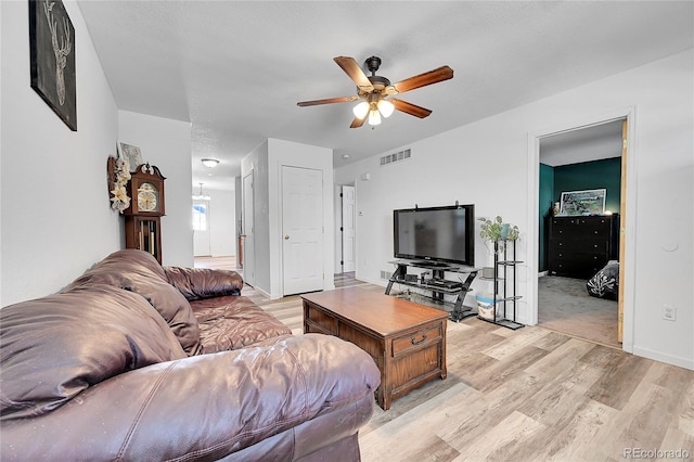 2791 Quarterland St, Strasburg, CO 80136 - living room with light wood-style floors and a ceiling fan