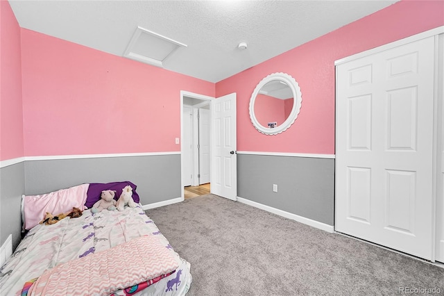 2791 Quarterland St, Strasburg, CO 80136 - bedroom featuring attic access, carpet, baseboards, and a textured ceiling