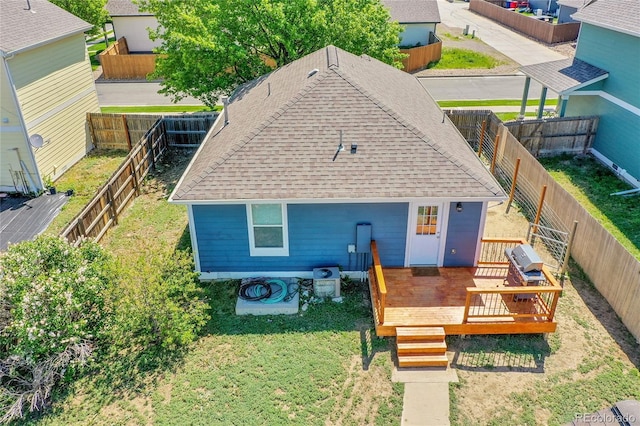 2791 Quarterland St, Strasburg, CO 80136 - view of front of property with roof with shingles and a wooden deck