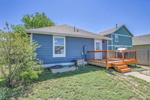 2791 Quarterland St, Strasburg, CO 80136 - back of property with a deck and roof with shingles
