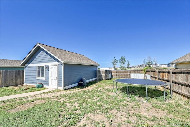 2791 Quarterland St, Strasburg, CO 80136 - view of yard featuring a trampoline and an outbuilding