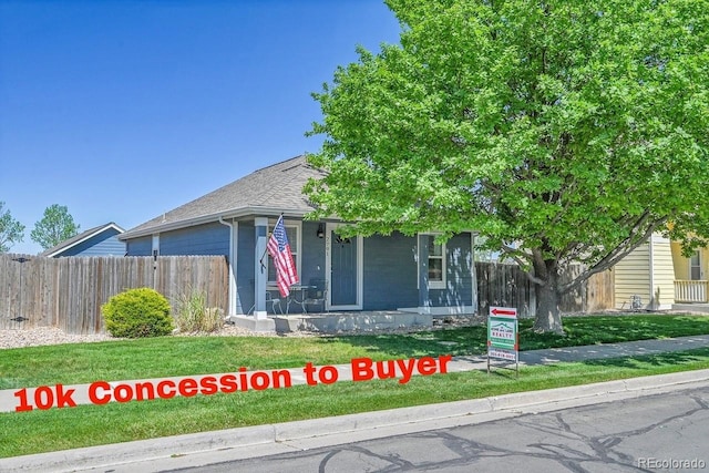 2791 Quarterland St, Strasburg, CO 80136 - view of front of home with roof with shingles and covered porch