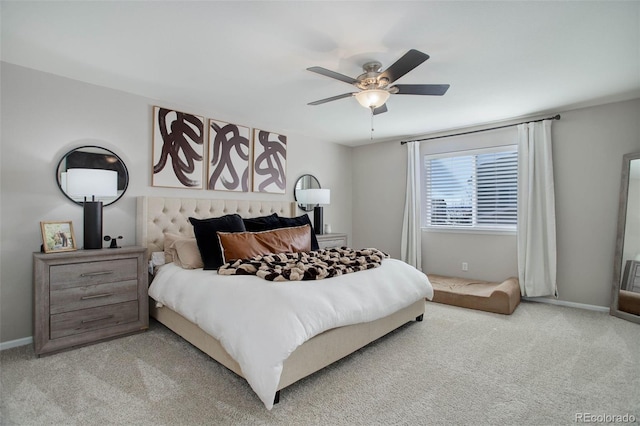 bedroom with ceiling fan and light carpet