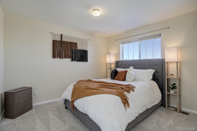 bedroom with light carpet