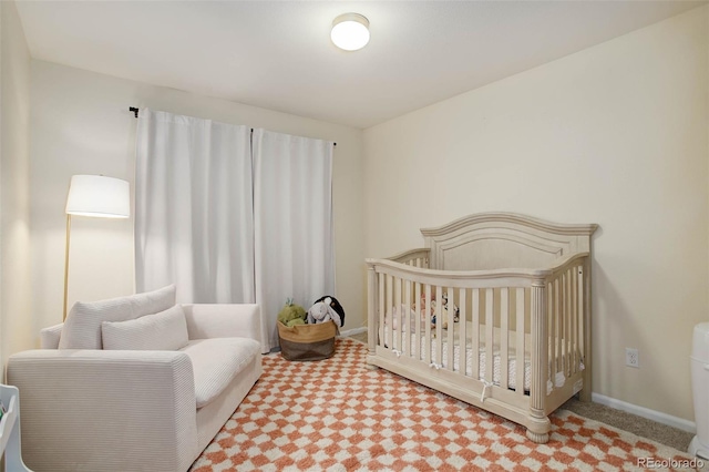 bedroom featuring a crib