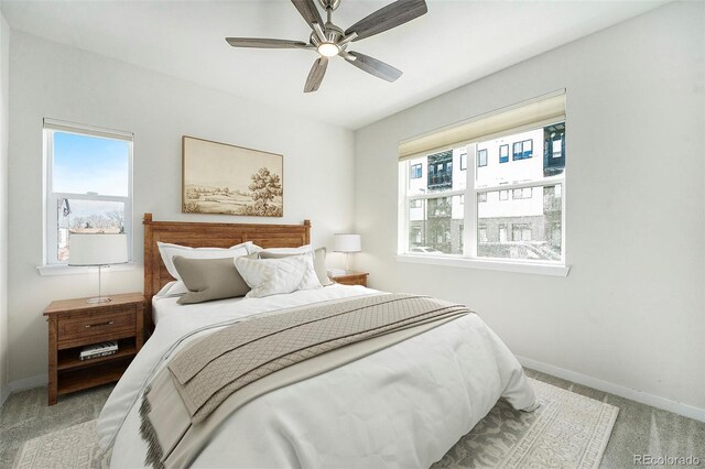 bedroom featuring carpet flooring, a ceiling fan, and baseboards