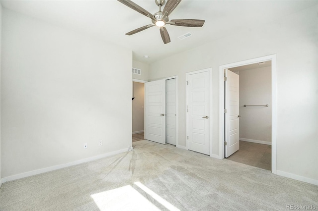 unfurnished bedroom featuring visible vents, baseboards, and carpet floors