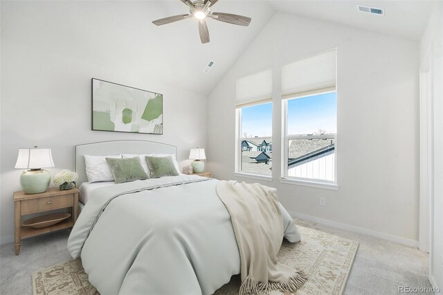 bedroom featuring visible vents, baseboards, high vaulted ceiling, ceiling fan, and light colored carpet