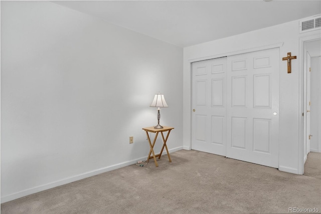 4875 S Balsam Way Unit 8-203, Littleton, CO 80123 - unfurnished bedroom featuring carpet floors and a closet