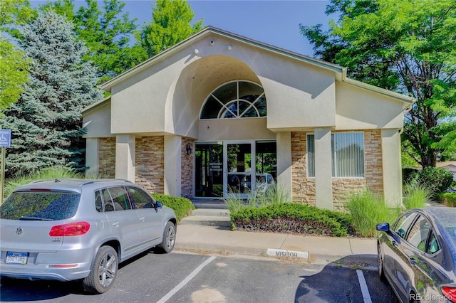4875 S Balsam Way Unit 8-203, Littleton, CO 80123 - view of property featuring uncovered parking