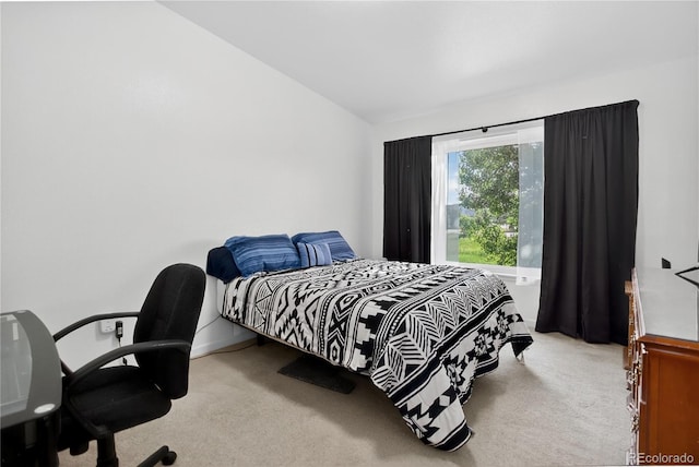 4875 S Balsam Way Unit 8-203, Littleton, CO 80123 - bedroom featuring carpet and lofted ceiling