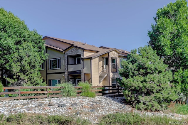 4875 S Balsam Way Unit 8-203, Littleton, CO 80123 - rear view of house featuring stone siding