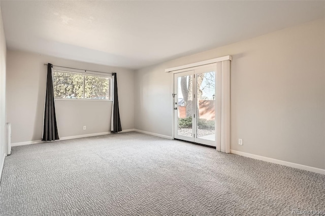 2201 S Holly St Unit 1, Denver, CO 80222 - spare room featuring healthy amount of natural light and carpet