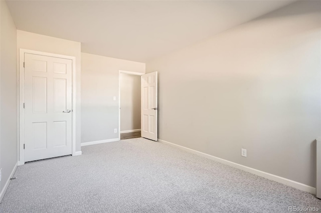 2201 S Holly St Unit 1, Denver, CO 80222 - unfurnished bedroom featuring carpet floors and baseboards