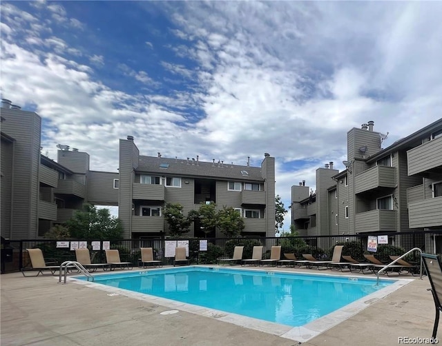 view of swimming pool with a patio area