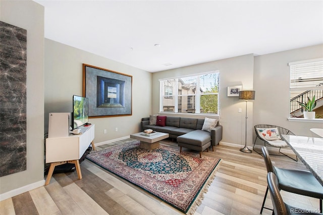 living room featuring wood finished floors and baseboards