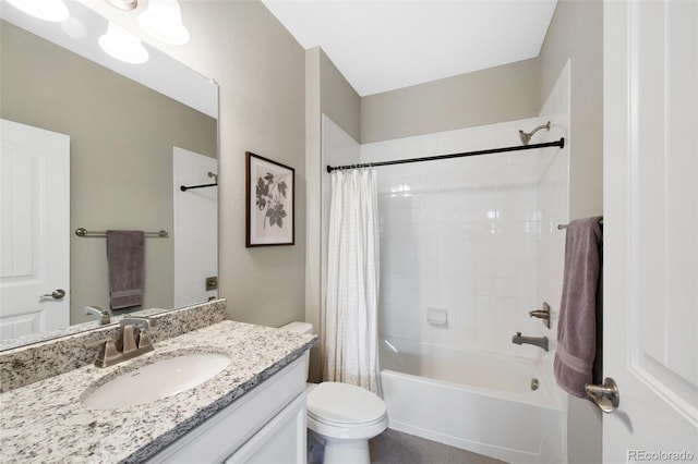 full bath featuring shower / bath combo with shower curtain, vanity, and toilet