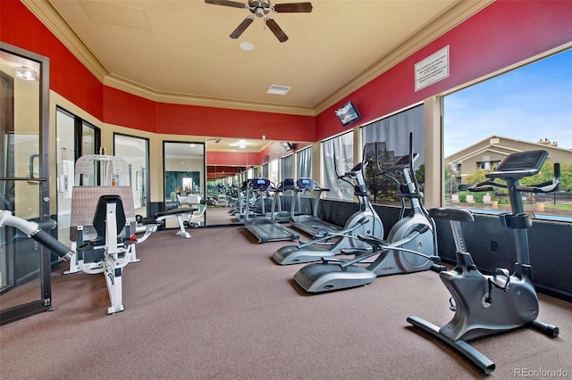 gym featuring a ceiling fan, visible vents, and ornamental molding
