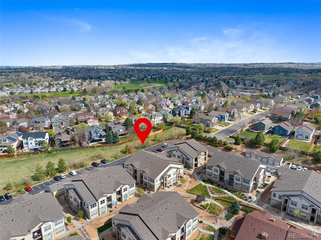 birds eye view of property with a residential view
