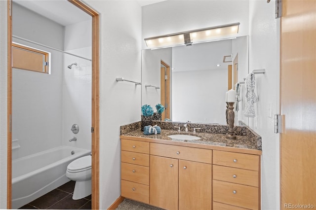 full bathroom featuring vanity, tub / shower combination, tile patterned floors, and toilet