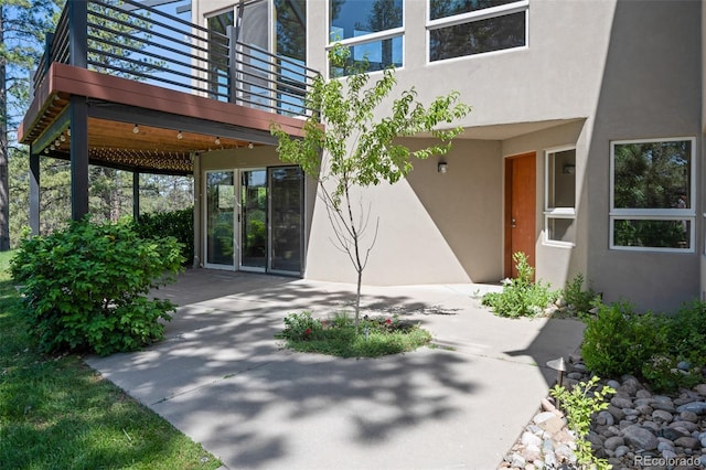 doorway to property with a patio area and a balcony